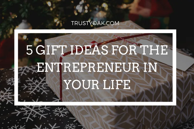 Curated holiday gift guide items for entrepreneurs including planners, headphones, and business books