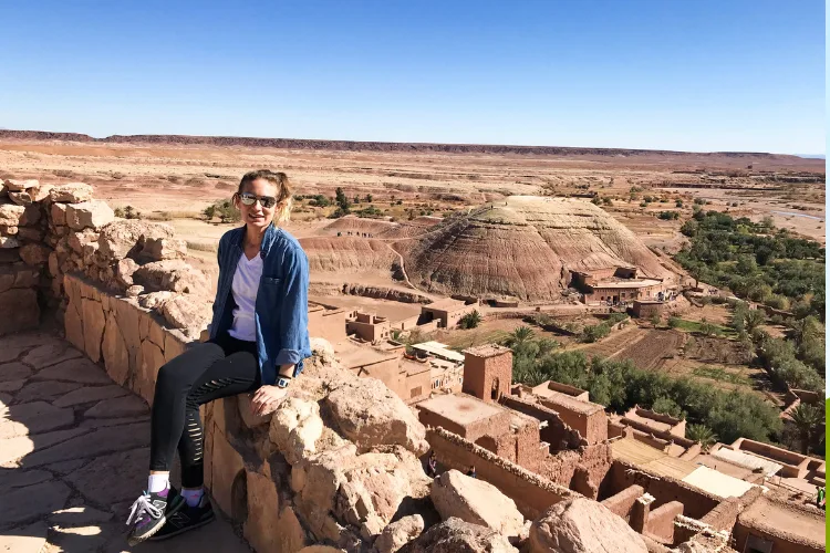 Digital nomad working remotely on laptop from scenic travel destination with WiFi setup