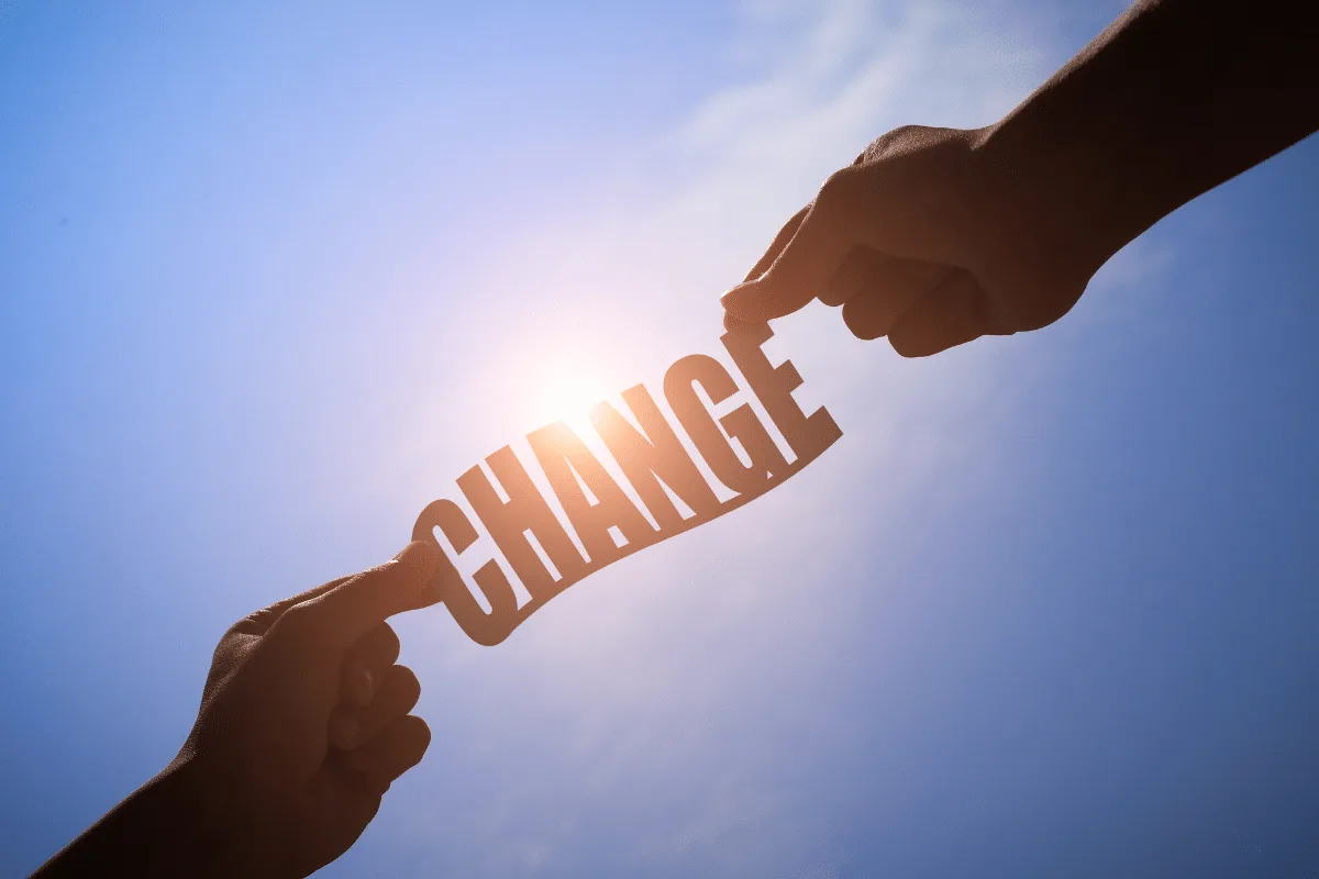 Business owner and virtual assistant embracing change through open communication and growth