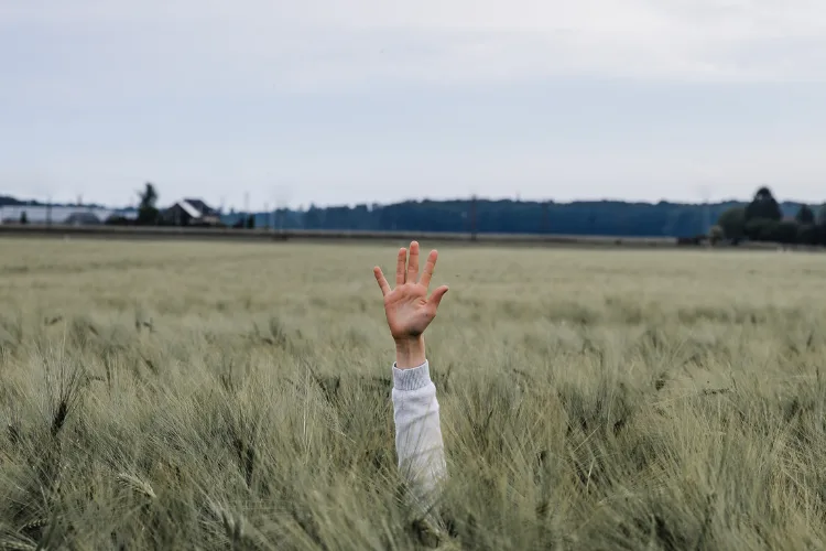 Stressed entrepreneur at desk overwhelmed with tasks, illustrating the need for delegation