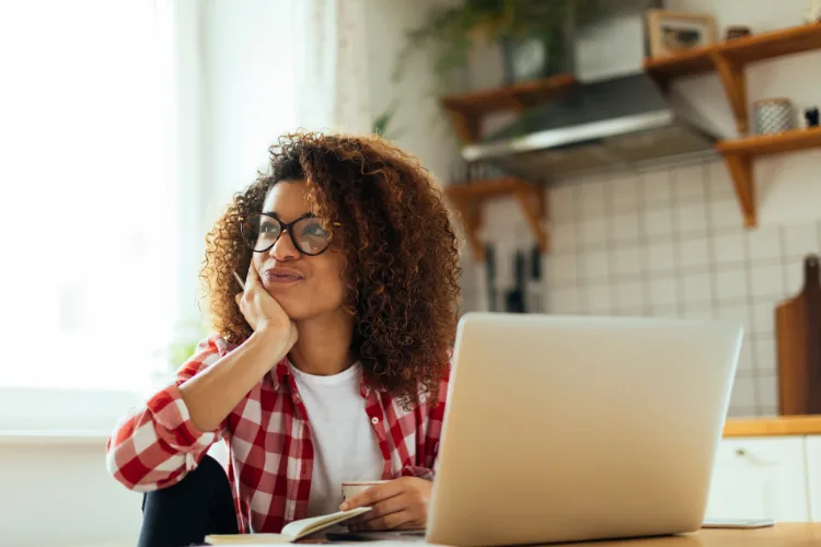 Introvert professional working peacefully from home office with laptop, cultivating work-life balance